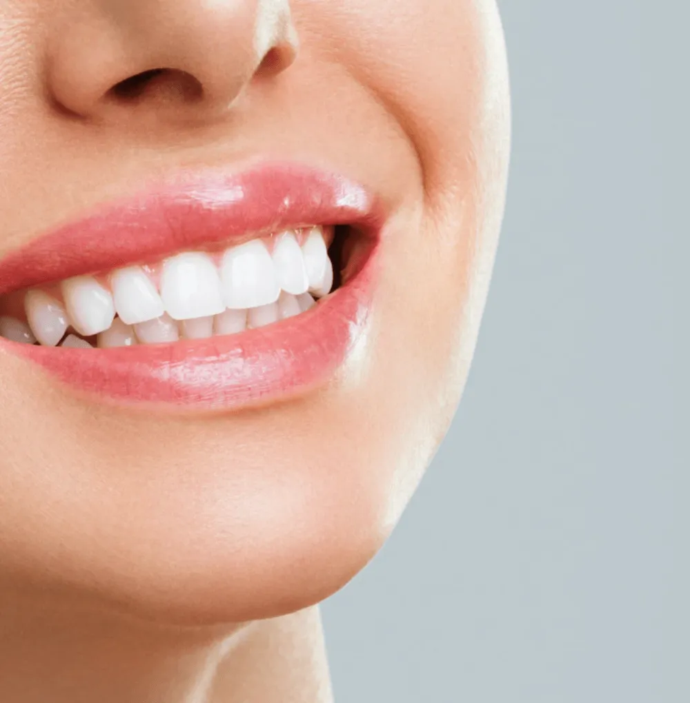 Hygienist cleaning a patient's teeth